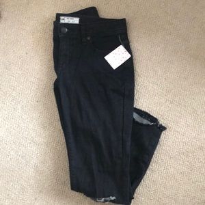 Free people skinny destroyed jeans.